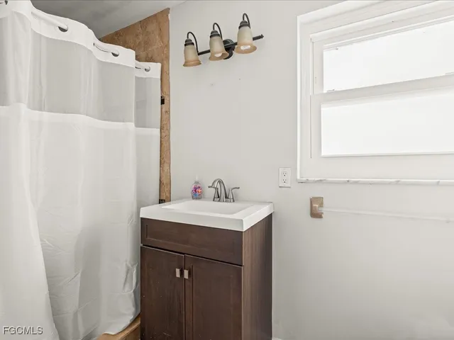 a bathroom with a sink and a mirror