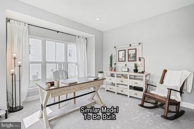 a living room with furniture a rug and a window