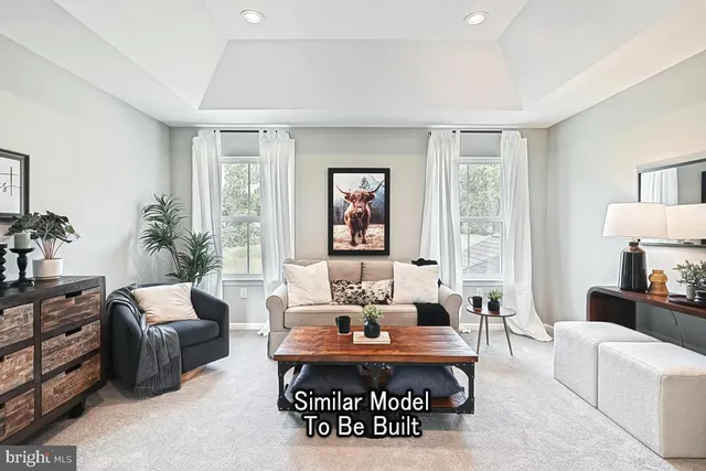 a living room with furniture a table and a large window