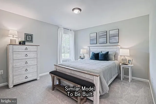 a bedroom with a bed and a dresser in it