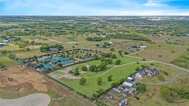 a view of a garden with houses