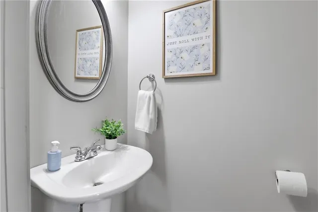 a hallway with a dining table chairs and couches