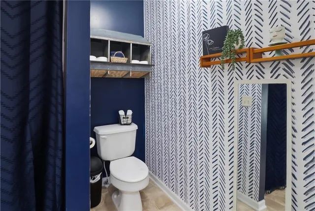 a view of a bathroom with a sink a mirror and a shower