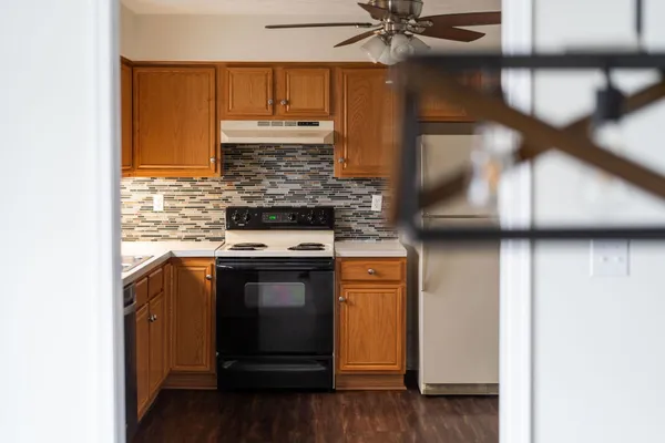a kitchen with stainless steel appliances a stove and a refrigerator