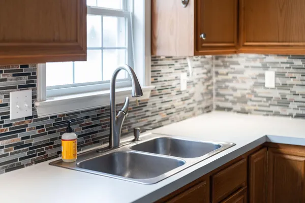 a kitchen with a sink and a window