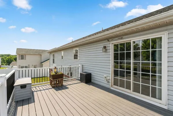 a view of a balcony with wooden floor