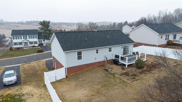 an aerial view of a house with a garden