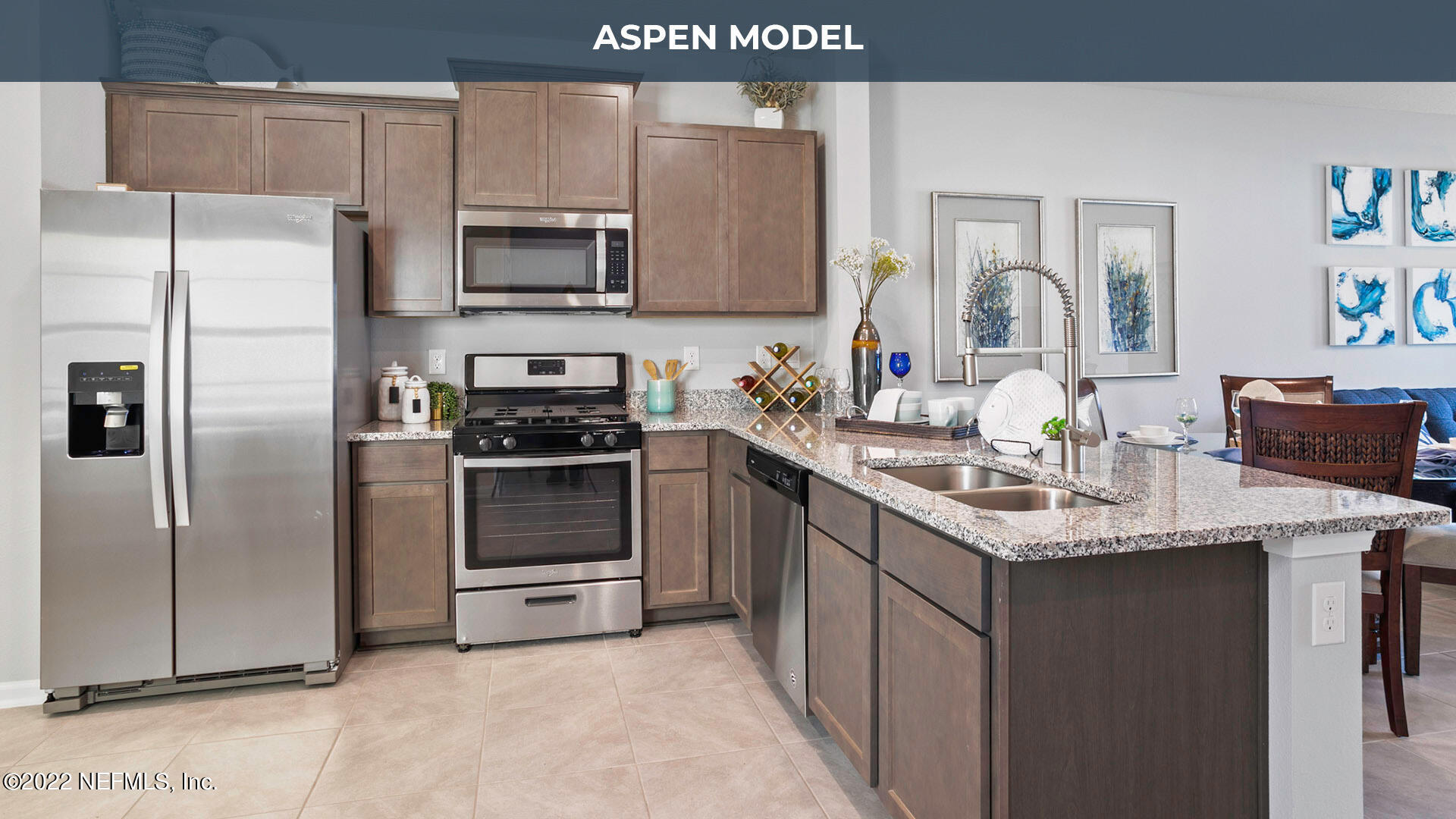 150 Java Lane St. Augustine, FL 32092 - Photo 5 of 36 a kitchen with a sink a microwave a refrigerator and cabinets