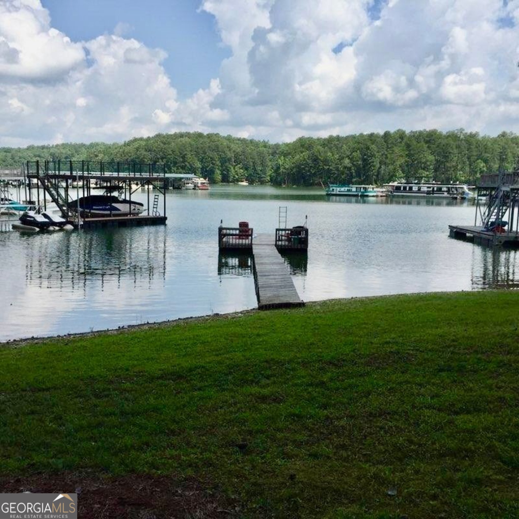 5400 Kings Camp Road Southeast, Unit B22 Acworth, GA 30102 - Photo 4 of 21 a view of a lake with houses in the back