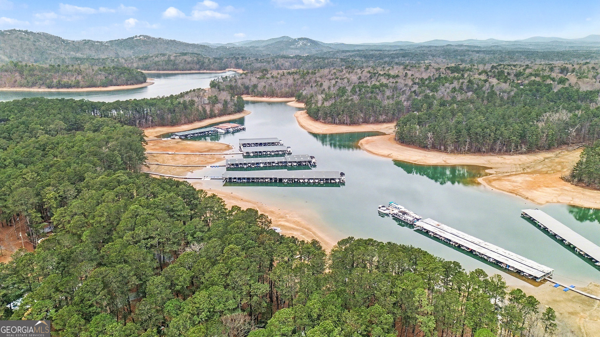 5400 Kings Camp Road Southeast, Unit B22 Acworth, GA 30102 - Photo 5 of 21 a view of a lake with a mountain in the background