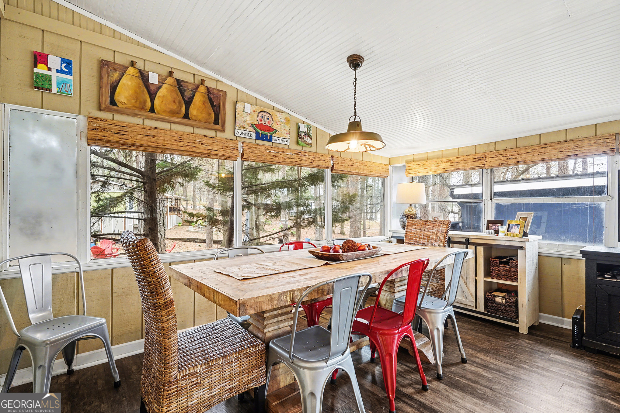 5400 Kings Camp Road Southeast, Unit B22 Acworth, GA 30102 - Photo 8 of 21 a view of a dining room and livingroom with furniture wooden floor a rug a flat screen tv and a chandelier