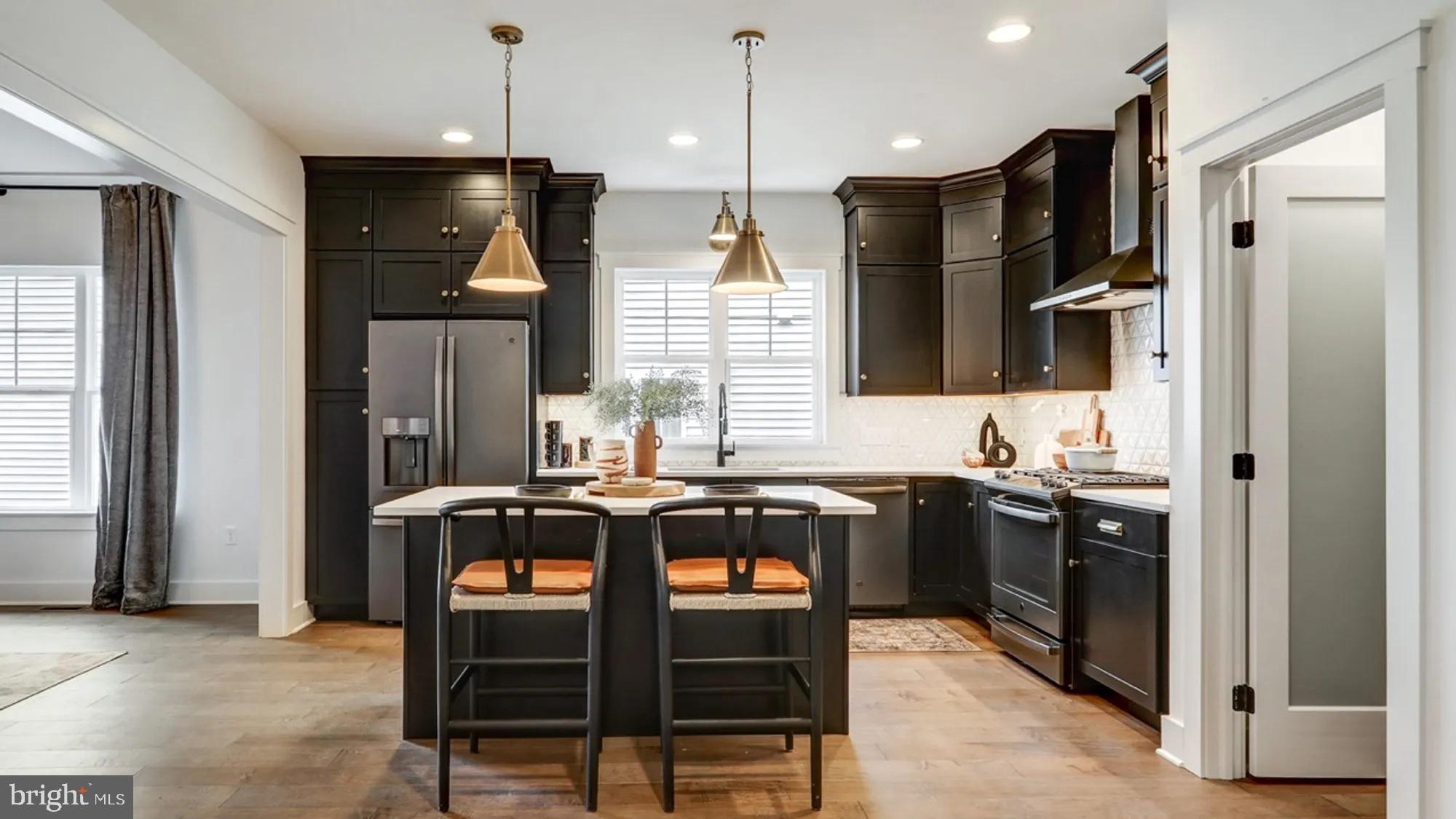 108 Flora Boulevard Lebanon, PA 17042 - Photo 2 of 44 a kitchen with stainless steel appliances granite countertop a stove refrigerator and microwave