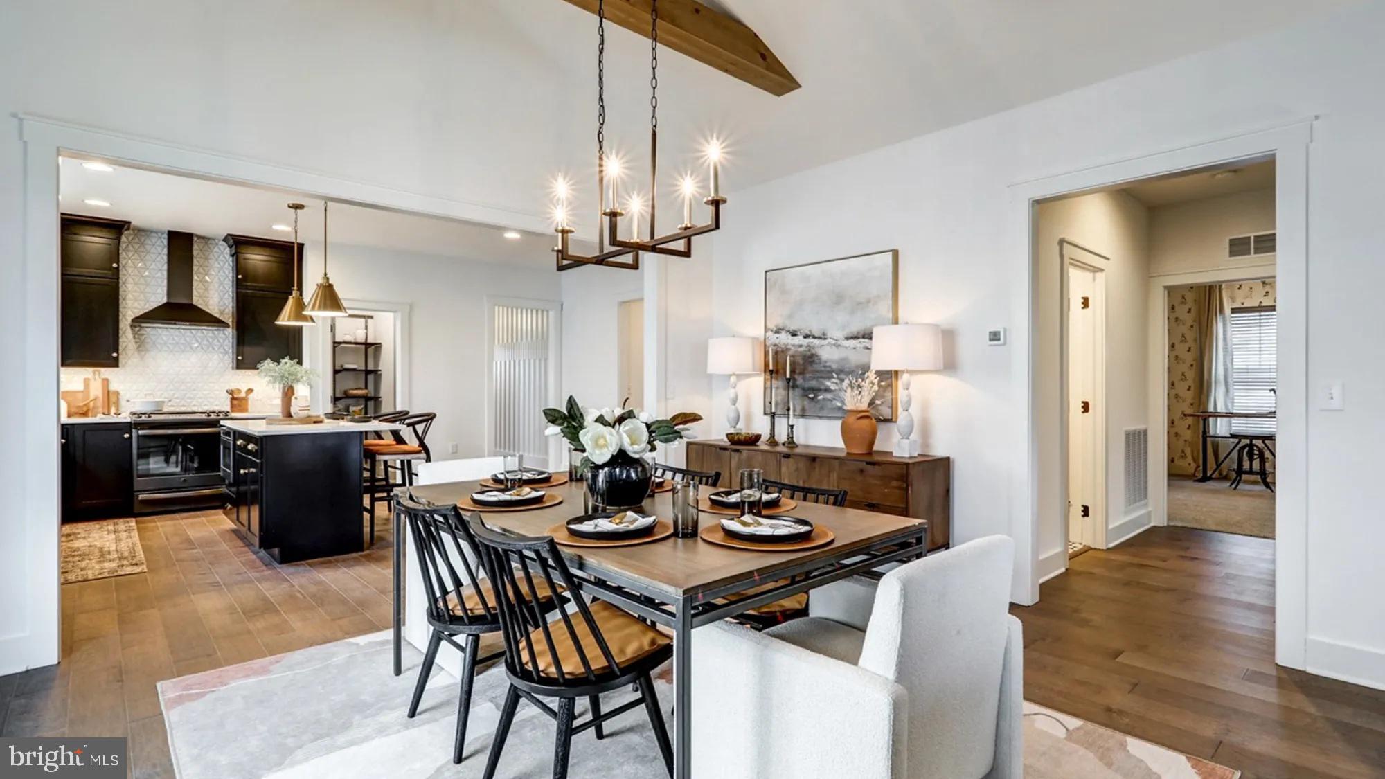 108 Flora Boulevard Lebanon, PA 17042 - Photo 25 of 44 a view of a dining room and livingroom with furniture wooden floor a chandelier