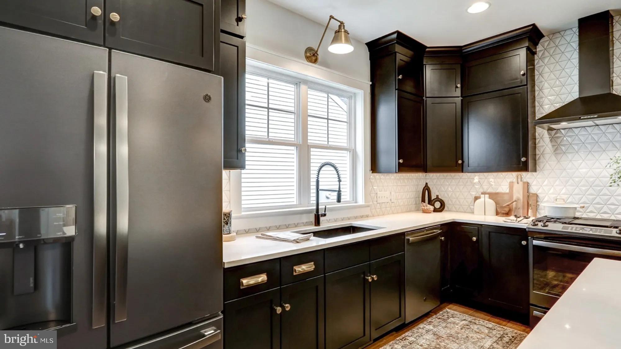 108 Flora Boulevard Lebanon, PA 17042 - Photo 8 of 44 a kitchen with a sink and a refrigerator