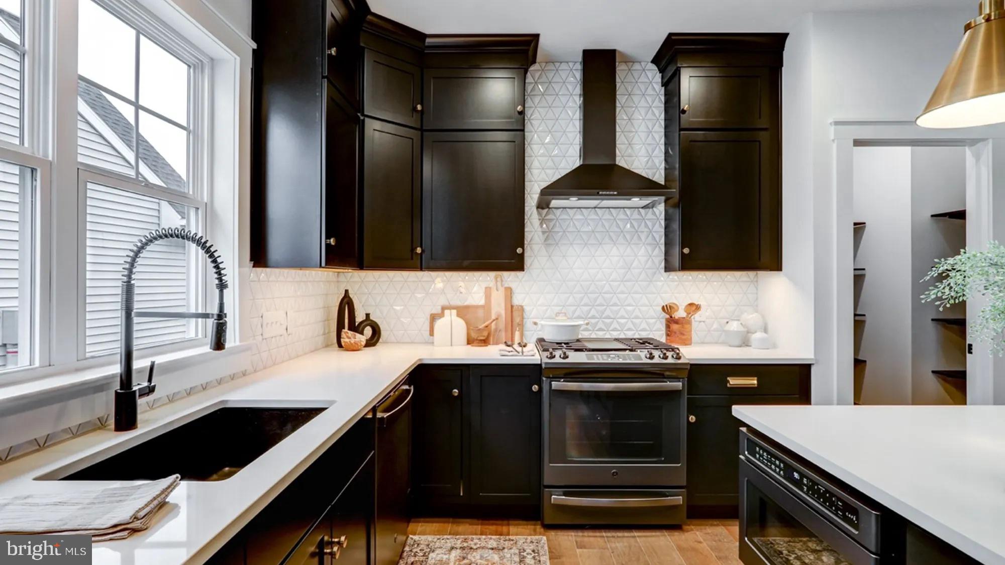 108 Flora Boulevard Lebanon, PA 17042 - Photo 9 of 44 a kitchen with a sink and a refrigerator