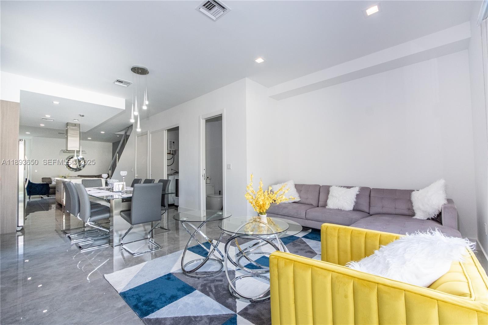 3461 Southwest 25th Street, Unit B Miami, FL 33133 - Photo 8 of 23 a living room with furniture and kitchen view