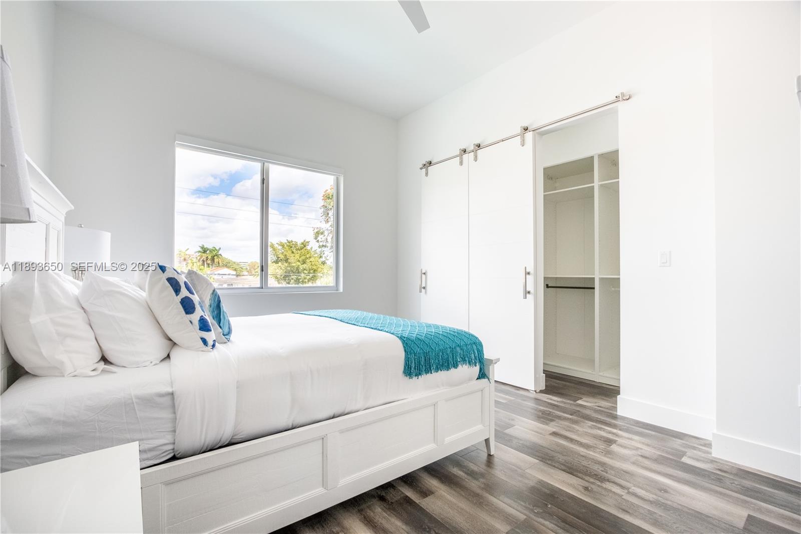 3461 Southwest 25th Street, Unit B Miami, FL 33133 - Photo 10 of 23 a bedroom with a bed and a window