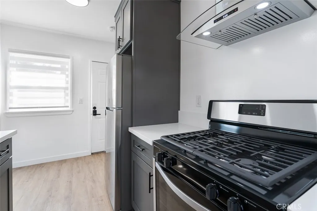 411 North Euclid Avenue Pasadena, CA 91101 - Photo 11 of 40 a stove sitting inside of a kitchen
