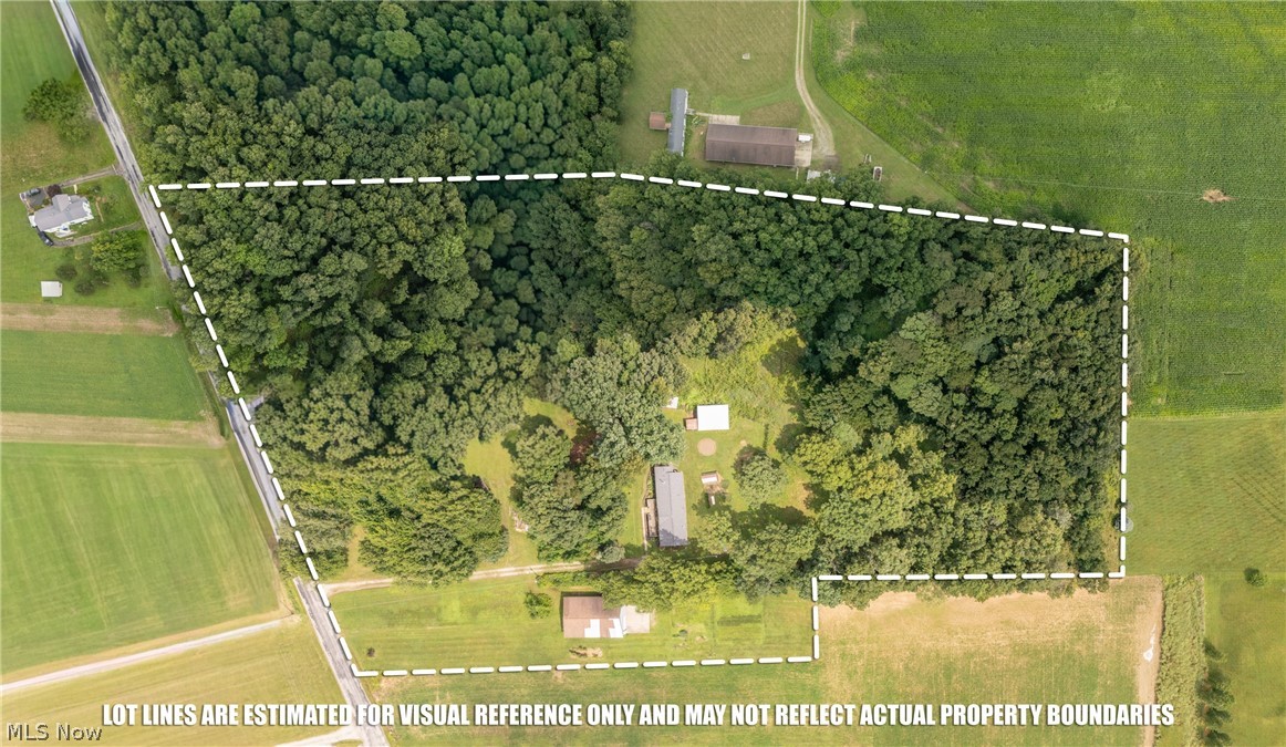 6828 Angling Road Wooster, OH 44691 - Photo 43 of 43 Expansive wooded parcel featuring a combination of dense tree cover and cleared areas, bordered by agricultural fields