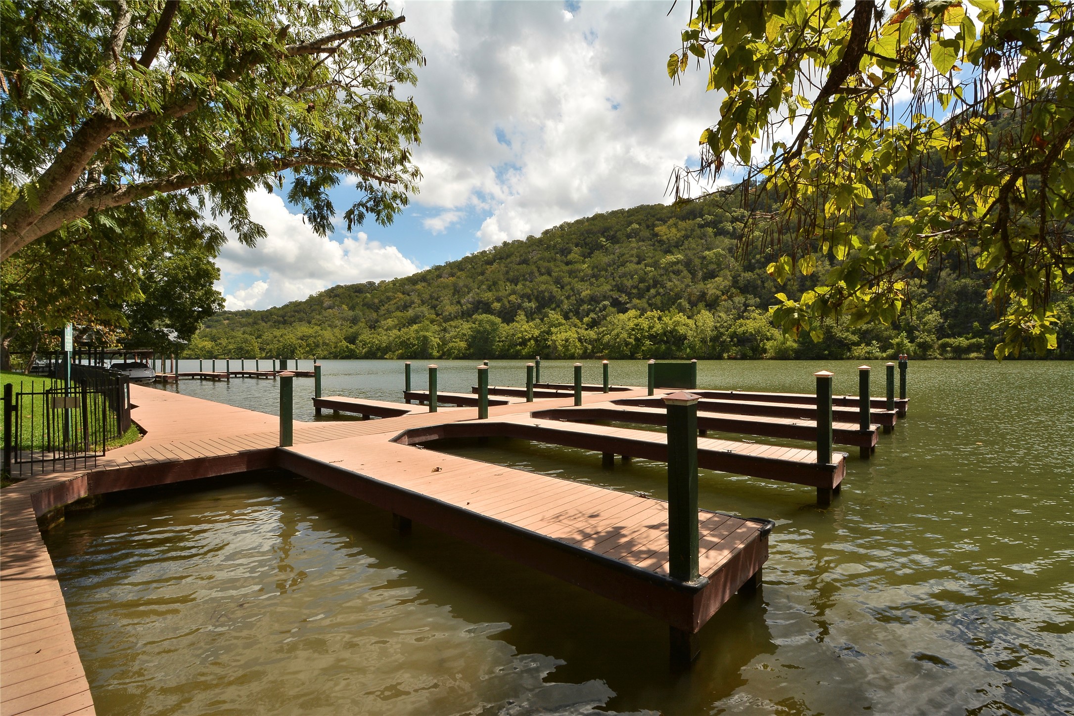 3513 Grimes Ranch Road Austin, TX 78732 - Photo 27 of 32 Dock featuring a wooded view and a water view