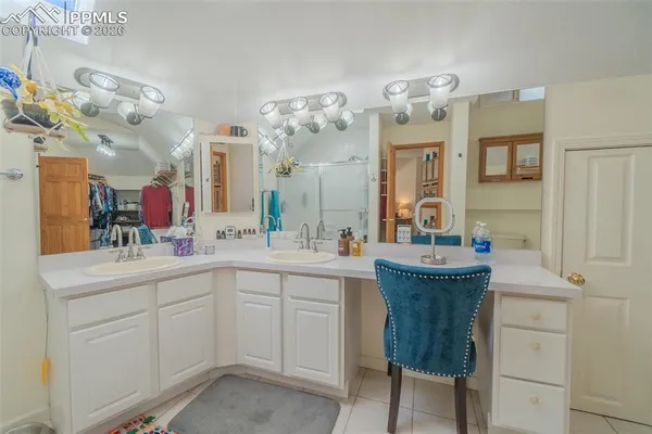 a room with a mirror and clock on the wall