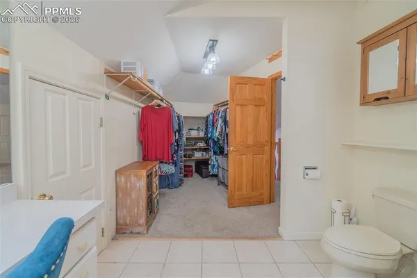 a bedroom with a bed and dresser