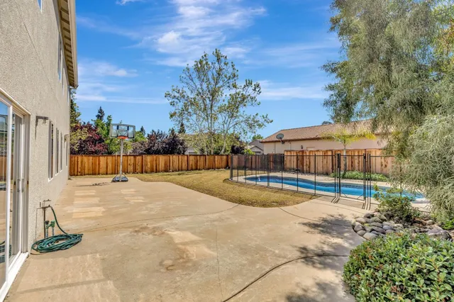 a view of a swimming pool with an outdoor seating