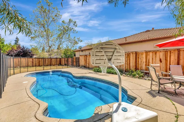 a balcony with table and chairs
