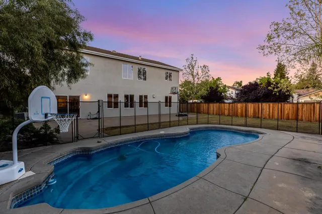 a view of a back yard with a patio