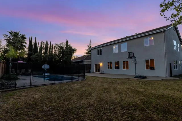 a house that has sitting area in front of it