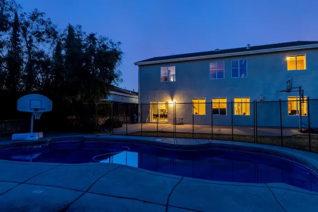 a view of a lobby area with furniture and chandelier