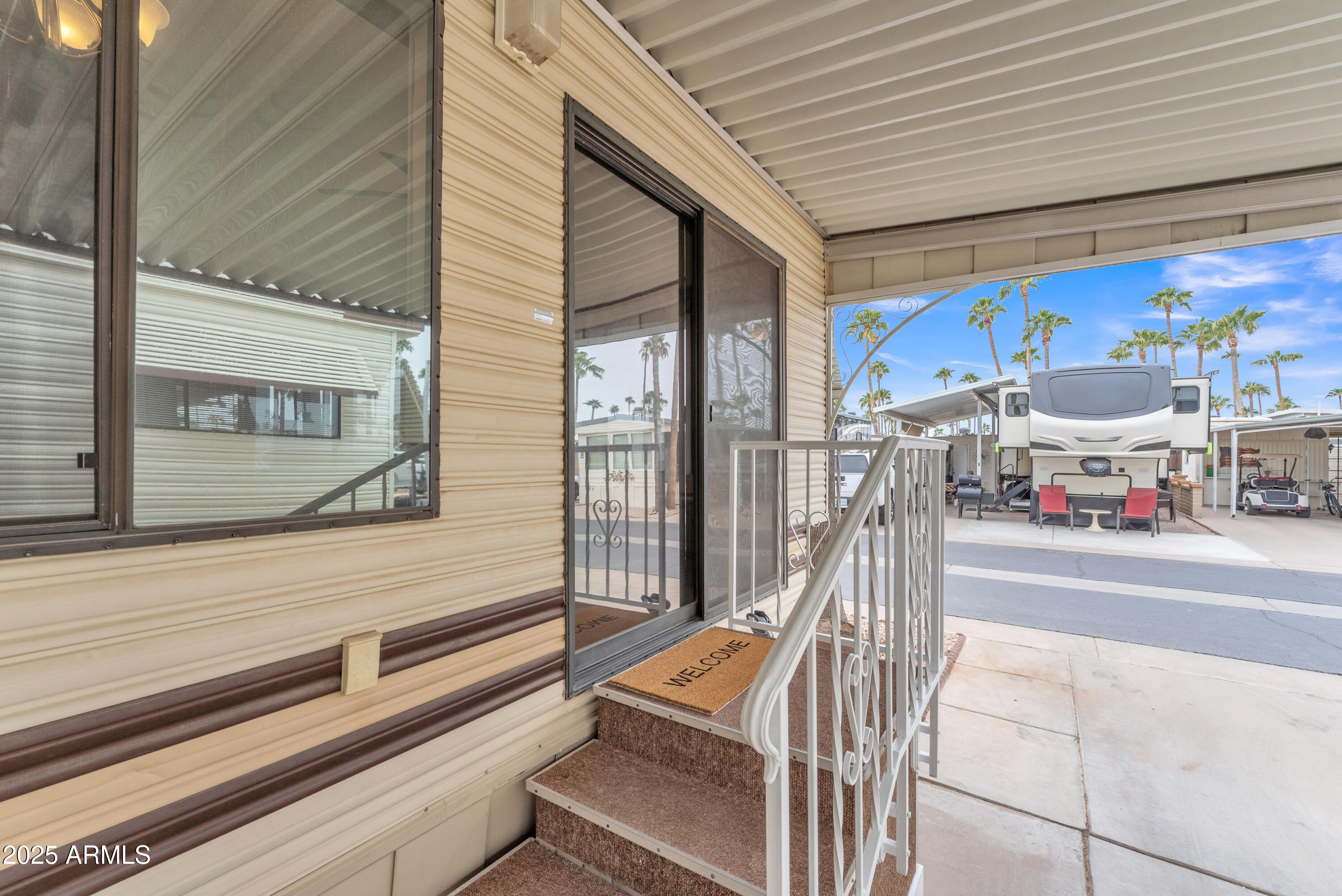 1152 South Sioux Drive Apache Junction, AZ 85119 - Photo 11 of 50 a view of a patio with a table and chairs