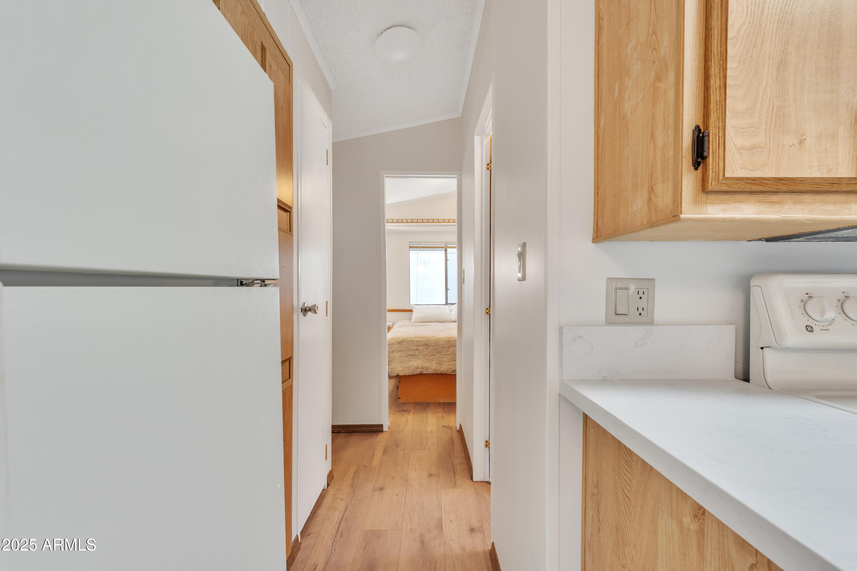 1152 South Sioux Drive Apache Junction, AZ 85119 - Photo 23 of 50 a kitchen with a refrigerator and a stove