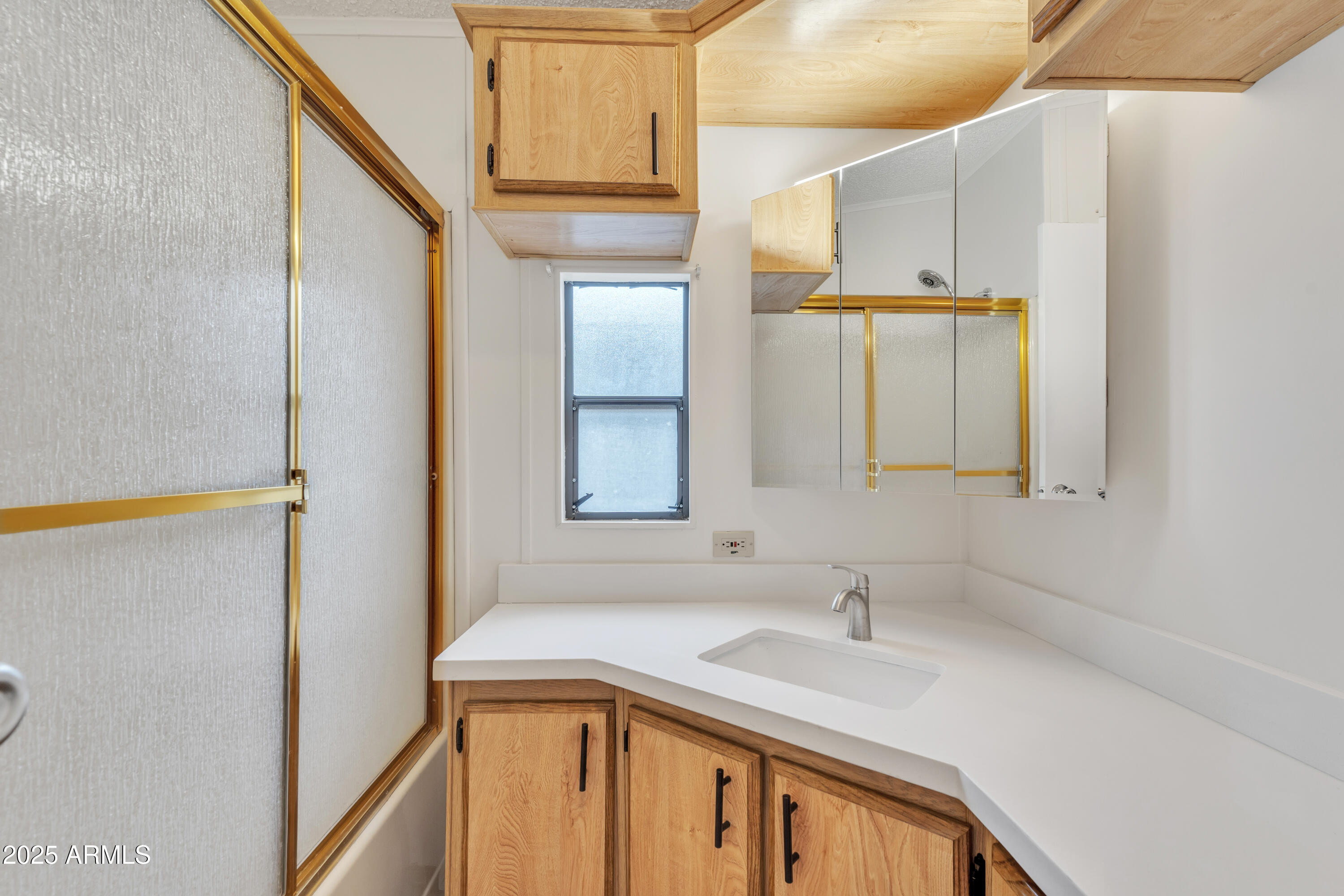 1152 South Sioux Drive Apache Junction, AZ 85119 - Photo 25 of 50 a bathroom with a sink and a mirror