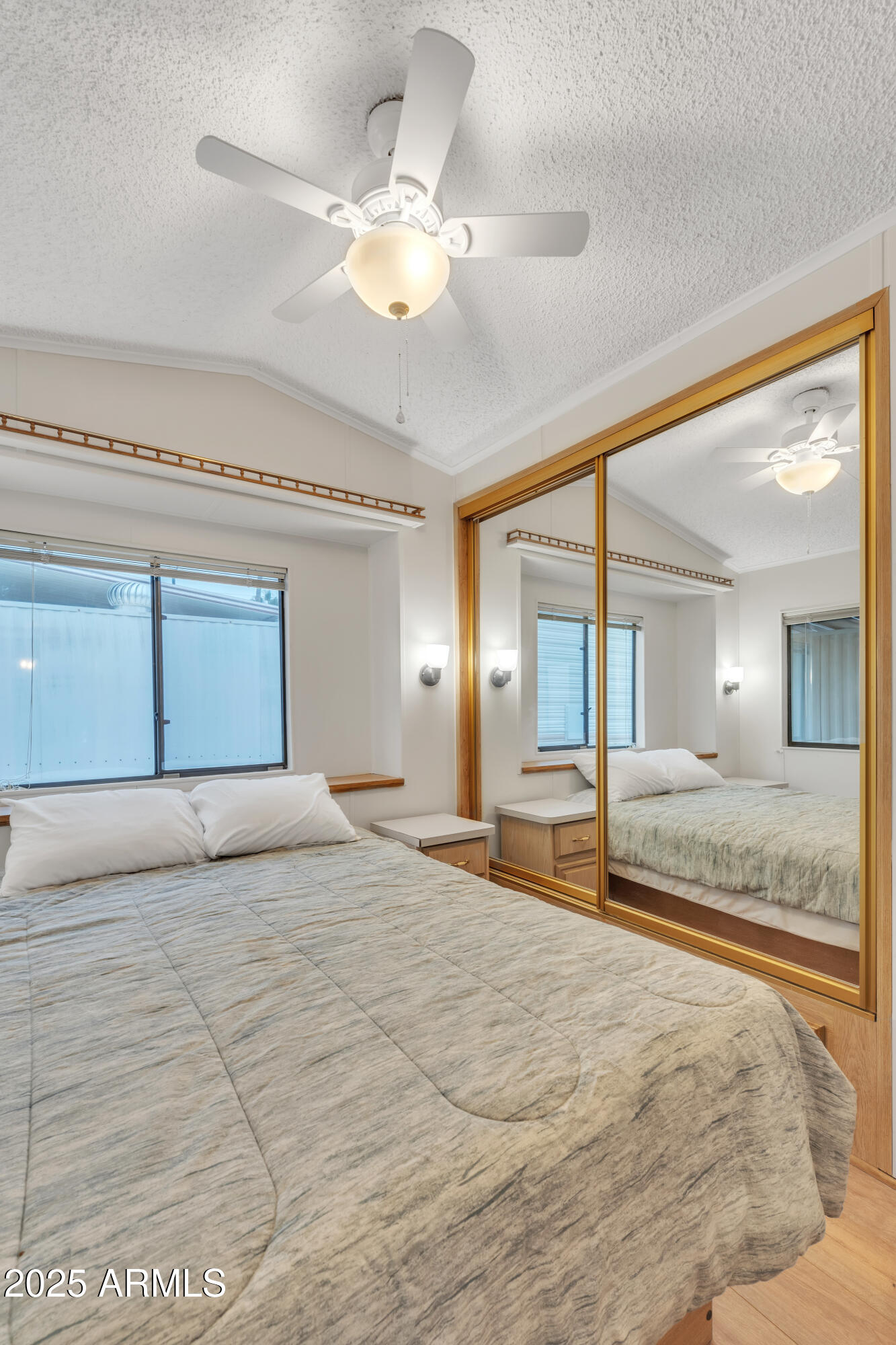 1152 South Sioux Drive Apache Junction, AZ 85119 - Photo 26 of 50 a bedroom with a large bed and a large window