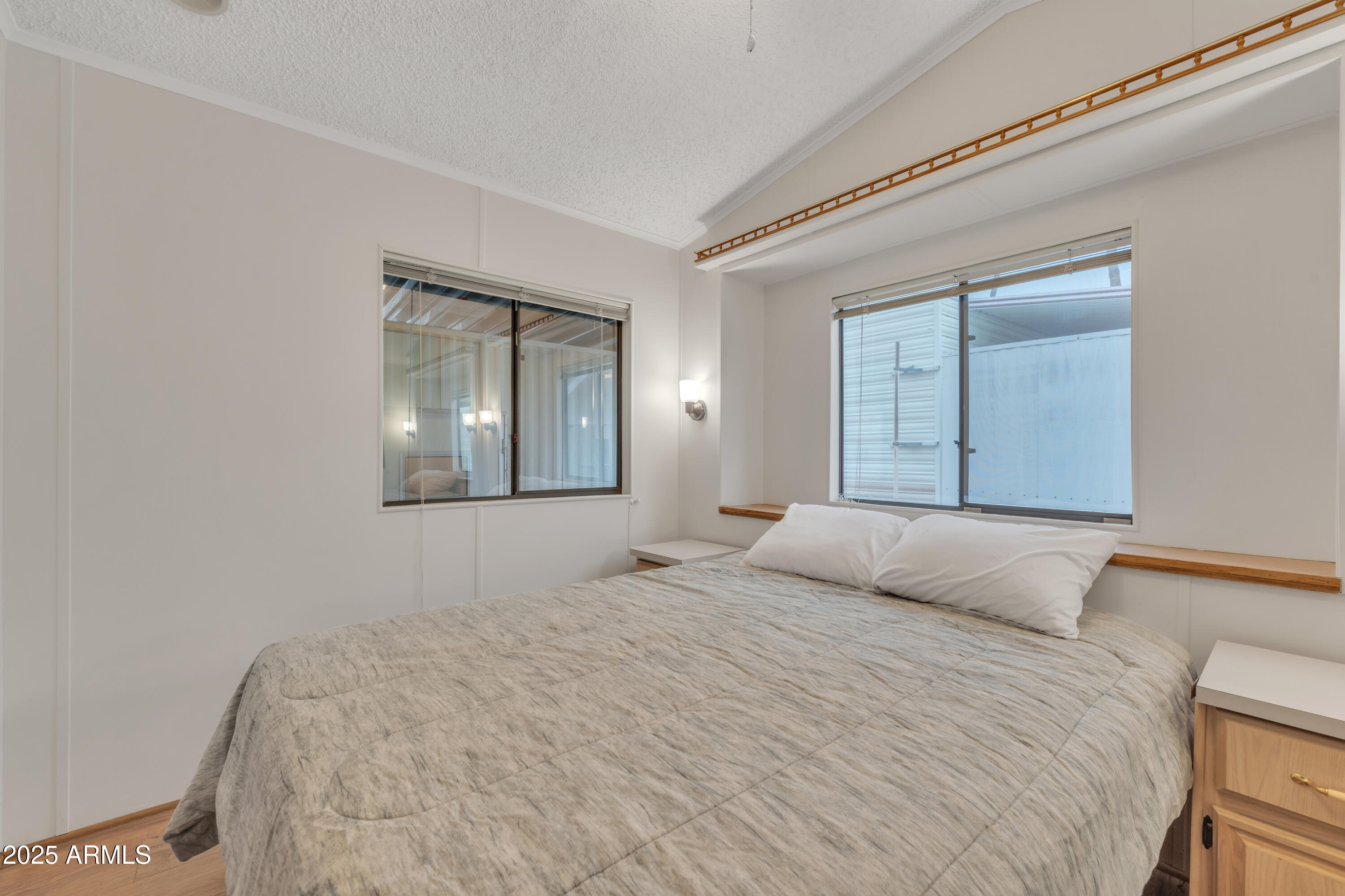 1152 South Sioux Drive Apache Junction, AZ 85119 - Photo 28 of 50 a bedroom with a bed and a mirror