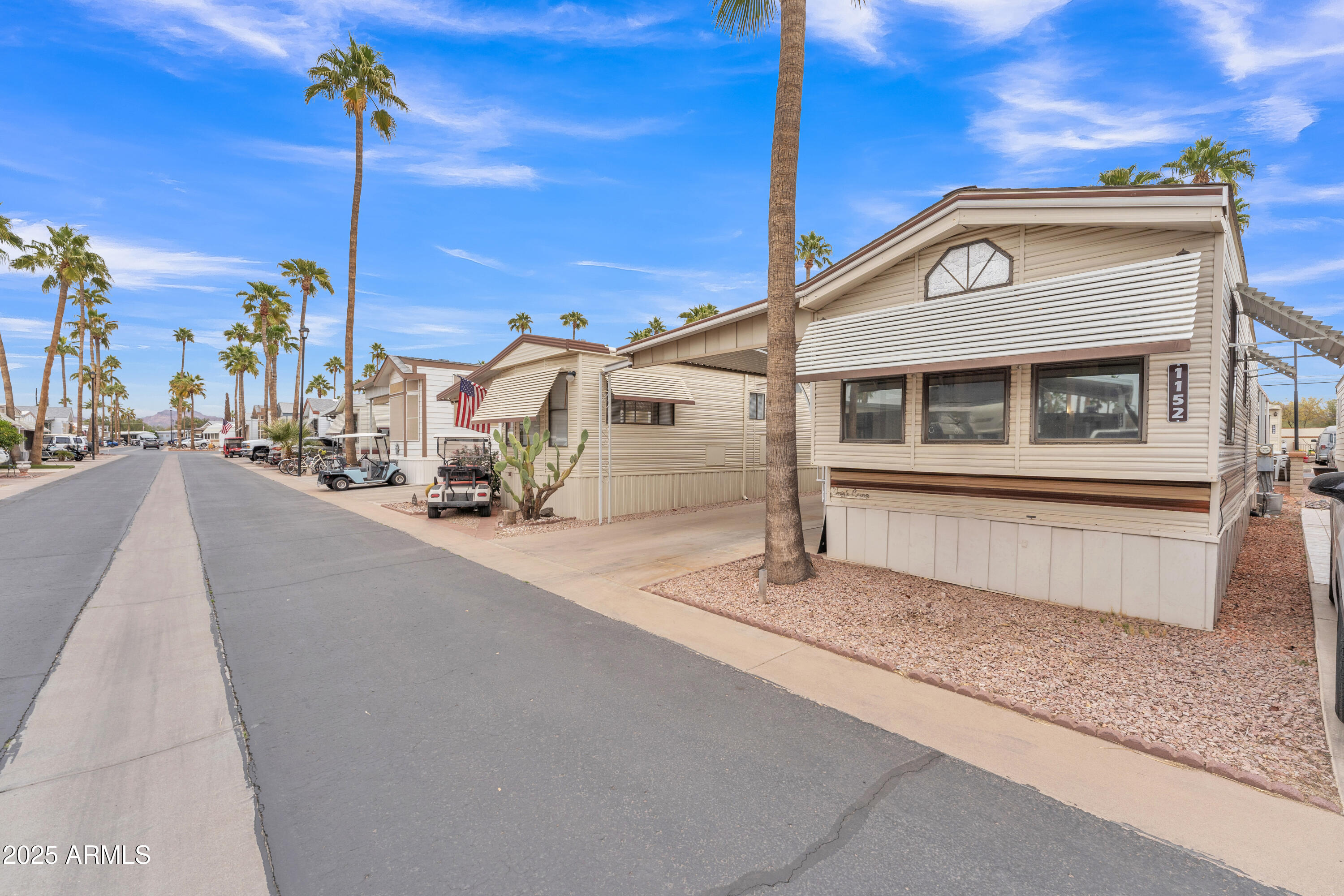 1152 South Sioux Drive Apache Junction, AZ 85119 - Photo 9 of 50 a front view of a house with a street