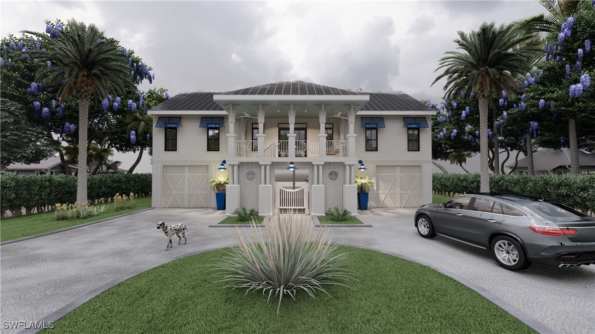 2163-2153 Periwinkle Way Sanibel, FL 33957 - Photo 11 of 37 a front view of a house with garden