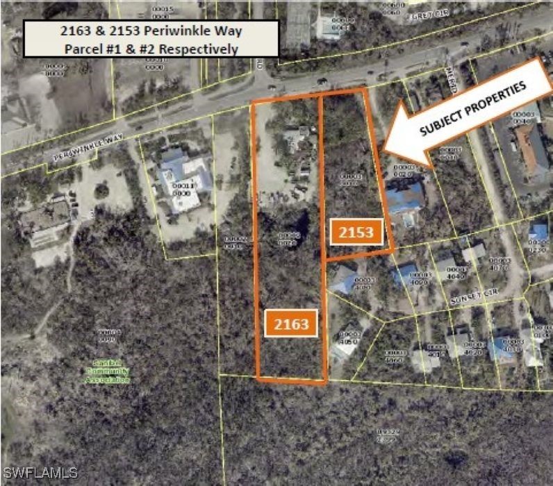 2163-2153 Periwinkle Way Sanibel, FL 33957 - Photo 2 of 37 a signage on a brick wall