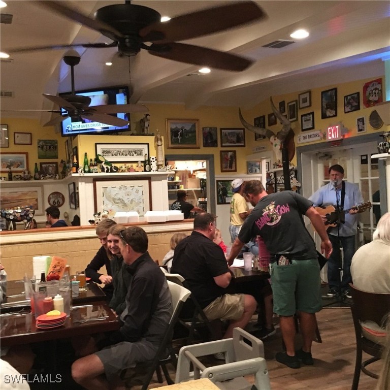 2163-2153 Periwinkle Way Sanibel, FL 33957 - Photo 24 of 37 a group of people sitting in a room