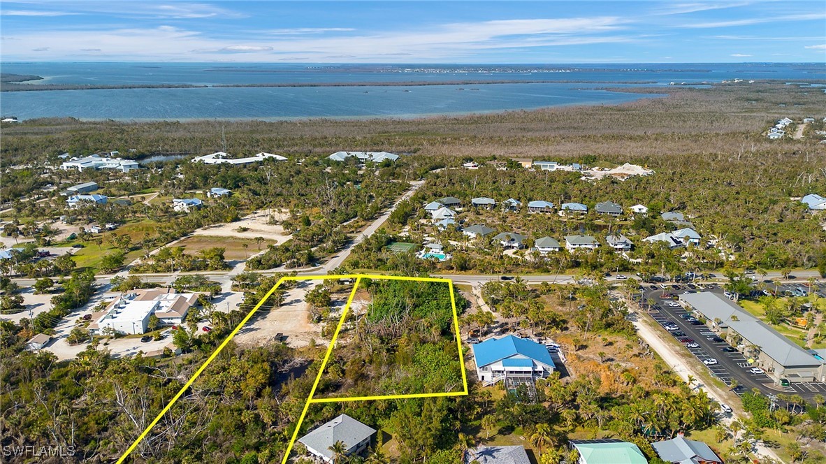 2163-2153 Periwinkle Way Sanibel, FL 33957 - Photo 33 of 37 an aerial view of residential houses with outdoor space