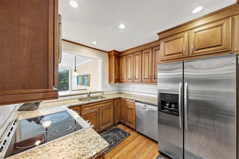 30 Chaumont Square Northwest Atlanta, GA 30327 - Photo 15 of 44 a kitchen with a sink stove and refrigerator