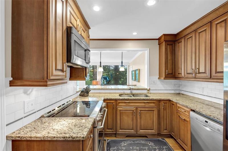 30 Chaumont Square Northwest Atlanta, GA 30327 - Photo 16 of 44 a kitchen that has a sink and a window in it
