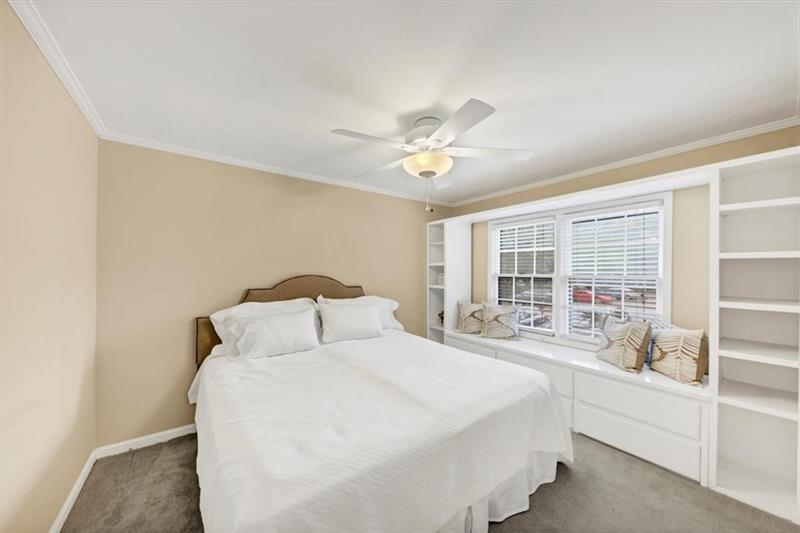30 Chaumont Square Northwest Atlanta, GA 30327 - Photo 21 of 44 a bedroom with a large bed and a window