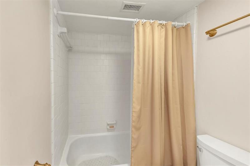 30 Chaumont Square Northwest Atlanta, GA 30327 - Photo 29 of 44 a bathroom with a shower and a curtain