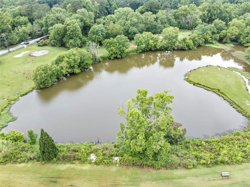 30 Chaumont Square Northwest Atlanta, GA 30327 - Photo 34 of 44 an aerial view of a house with a yard and lake view