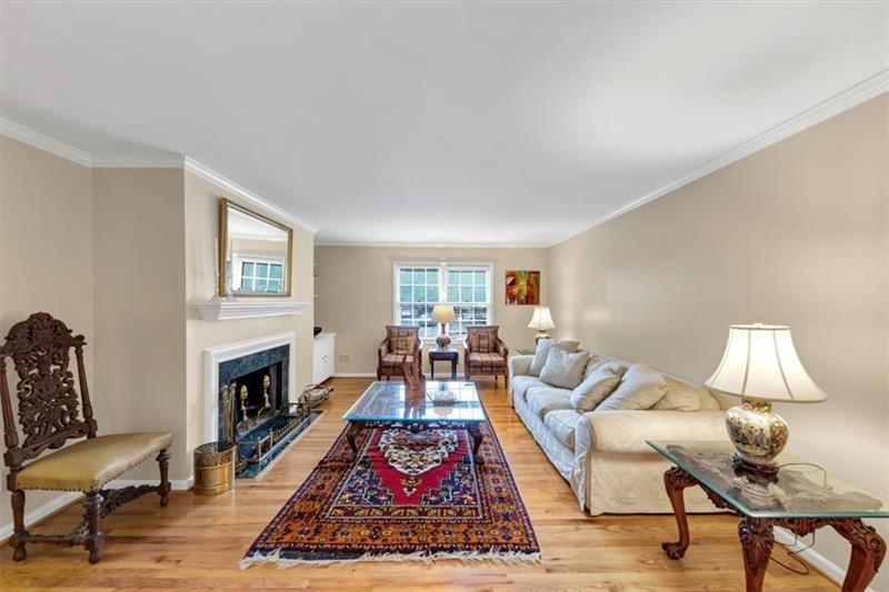 30 Chaumont Square Northwest Atlanta, GA 30327 - Photo 5 of 44 a living room with furniture and a fireplace