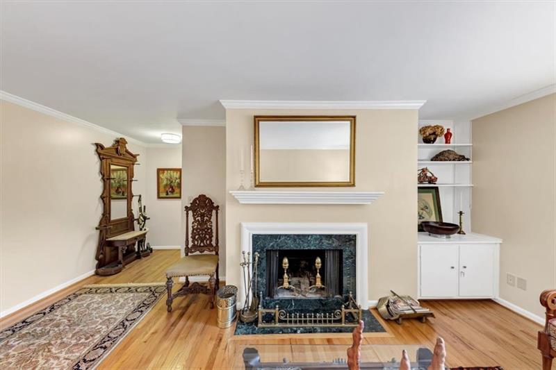 30 Chaumont Square Northwest Atlanta, GA 30327 - Photo 7 of 44 a living room with furniture and a fireplace