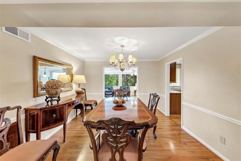 30 Chaumont Square Northwest Atlanta, GA 30327 - Photo 9 of 44 a view of a dining room with furniture window and outside view