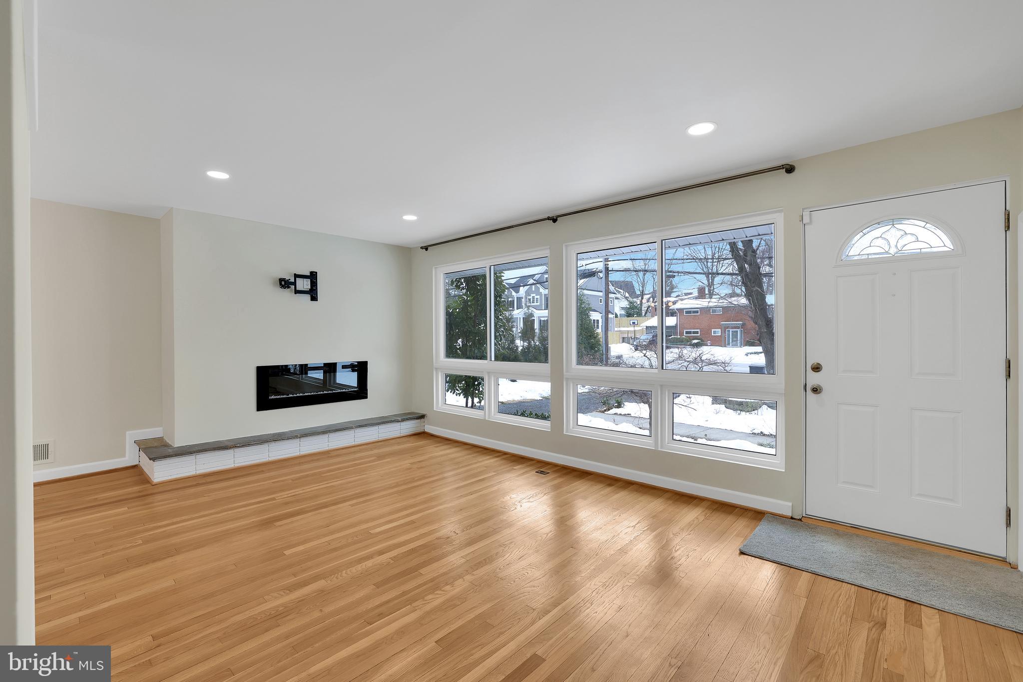 6718 Old Chesterbrook Road McLean, VA 22101 - Photo 14 of 38 a view of empty room with wooden floor and fireplace